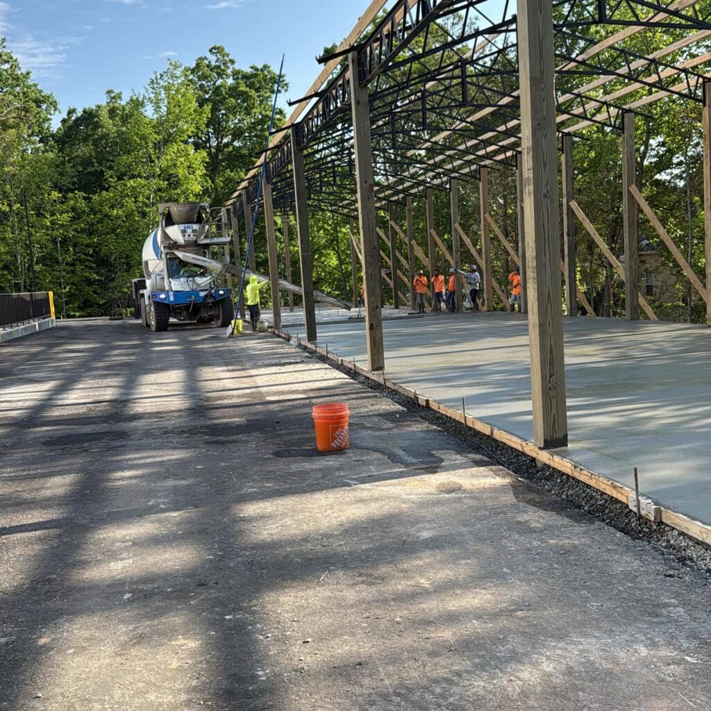 Concrete contractor in Dickson, TN completing a commercial concrete project, demonstrating how concrete work cost varies