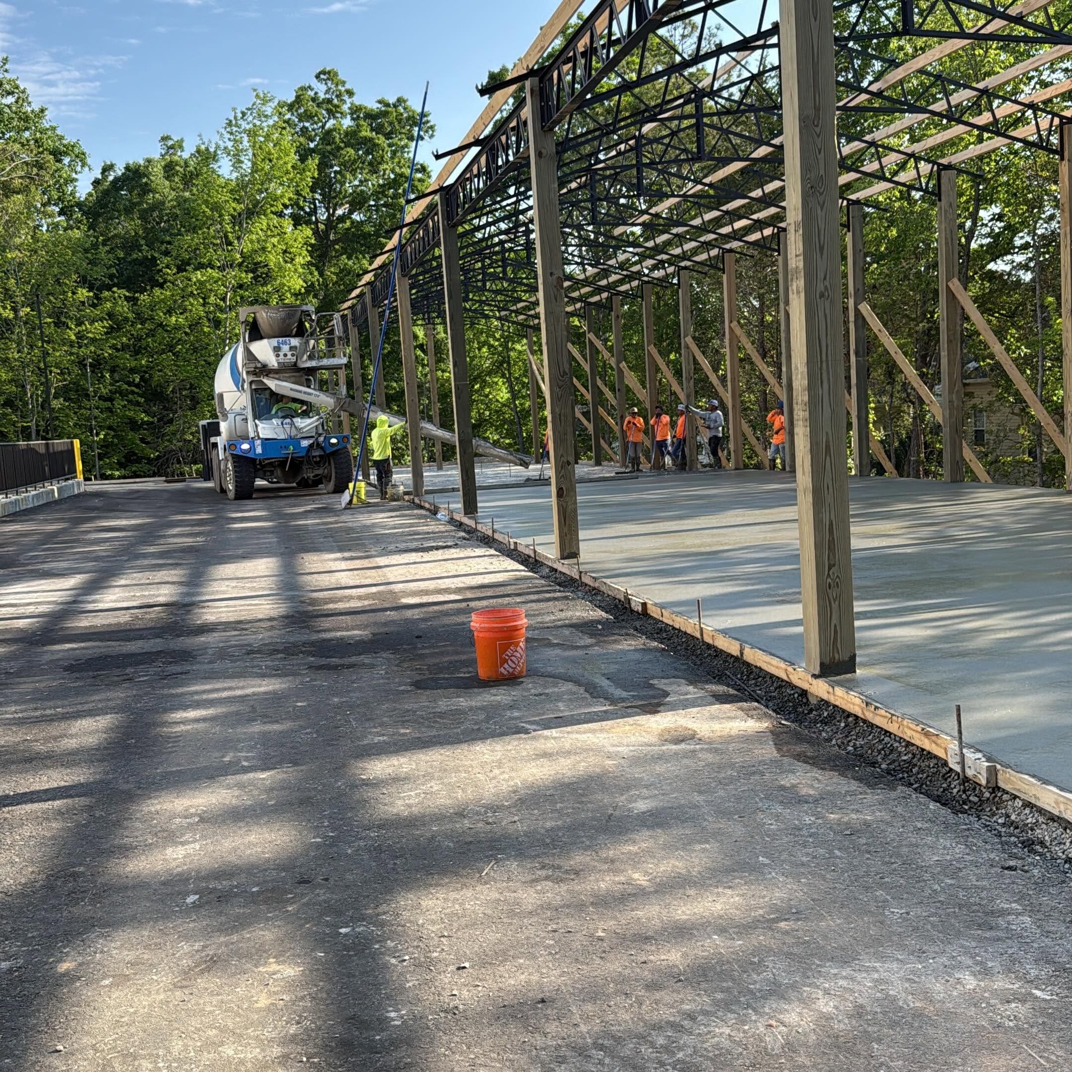 Concrete contractor in Dickson, TN completing a commercial concrete project, demonstrating how concrete work cost varies